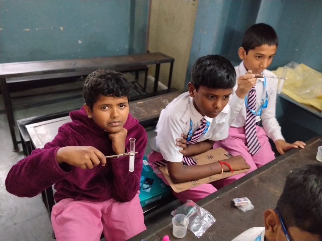 Students conducting hands-on STEM and physics experiments with Meridian science kits